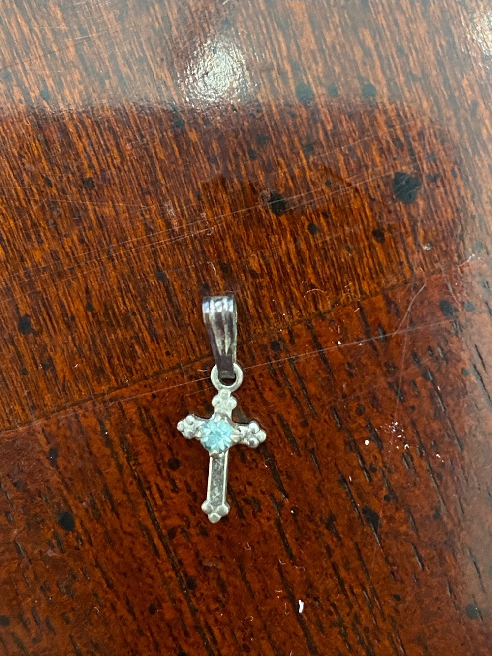 Sterling Silver Cross Pendant with Light Blue Stone